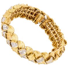 Hammerman Bros. bracelet in 18K yellow gold with round diamonds. The woven style bracelet is set with 224 round brilliant-cut diamonds totaling 11.45 carats, F-G color and VVS-VS clarity. Measures 7 1/2 inches long and 5/8 inches wide. Marked "18K HB" on the clasp. Bracelet With Diamonds, 18k Gold Bracelet, Expensive Jewelry Luxury, Sparkly Jewelry, Woven Bracelet, Expensive Jewelry, Woven Bracelets, Diamond Bracelets, Vintage Bracelets