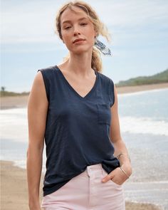 This casual layering tank top elevates the everyday with a flattering open neckline and a cute pocket detail. Wonderfully soft in Peruvian organic pima cotton with terrific slubbed texture. Classic fit. V-neckline. Sleeveless. Chest pocket. Hip length. 100% organic pima cotton. Women's pima cotton tank top by Garnet Hill. Loose Summer Tops, Summer V-neck Top With Pockets, Summer Sleeveless Tops With Pockets, Casual V-neck Tops With Side Pockets, Sleeveless Summer Tops With Side Pockets, Sleeveless Tops With Pockets For Everyday, Summer Everyday Tops With Side Pockets, Everyday Summer V-neck Tank Top, Summer V-neck Tank Top