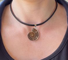 Ammonite Fossil Necklace - Ammonite Necklace - Leather Fossil Necklace - Ammonite Necklace - Ammonite Pendant -  Leather Necklace 1 pc. Ammonite Fossil Necklace, genuine leather ( flat, 4 mm ) Pendant size : 1.5 inch / 4 cm Available lengths for the cord:  14 inch / 35 cm 15 inch / 38 cm 16 inch / 40 cm  17 inch / 43 cm  18 inch / 45 cm Free gift box: You will receive this necklace in a beautiful gift box with cushion inside! Let me pleasantly surprise your loved ones on your behalf if it's a gift! You will receive one necklace of your desired length with a pendant very similar in size, shape, pattern and quality to the ones in photos. If you wish to pick your pendant - please contact me! If you need a special handmade jewelry - something unique or just have a question/comment just contact Ammonite Necklace, Fossil Necklace, Ammonite Jewelry, Fossil Jewelry, Necklace Leather, Ammonite Fossil, Gold Girl, Funky Jewelry, Jewelry Inspo