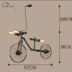 an image of a bicycle with lights attached to the front and back wheels, on a gray background