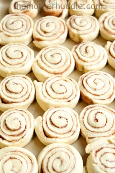 cinnamon rolls are on a baking sheet ready to be baked in the oven for breakfast