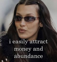 a woman wearing sunglasses with the words i easily attract money and abundance on her face