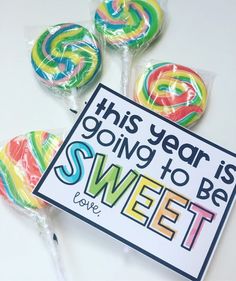 this year is going to be sweet come candy lollipops on a stick