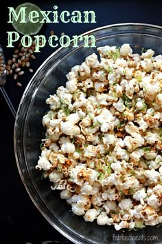 mexican popcorn in a glass bowl with sprinkles on the side next to it