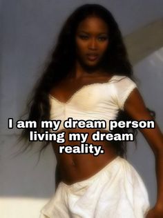 a woman in white dress with the words i am my dream person living my dream reality