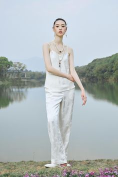 Feel elegant and sophisticated in this white silk spaghetti strap set. Crafted from premium silk, this timeless design will have you looking and feeling beautiful. The delicate spaghetti straps and soft, luxurious pattern of this set make it the perfect piece for any special occasion. Slip into luxury with this classic set. Sleeveless Blouse and Pants VISCOSE 100% Imported Brand - FUYAOZHISHANG Model Number - FYV133, FYP134 Luxury Elegant Sleeveless Blouse Piece, White Silk Spaghetti Strap Camisole, Semi-stitched Sleeveless Art Silk Sets, Luxury Classic Sleeveless Blouse, Unstitched White Slub Silk Sets, Luxury White Silk Blouse, Silk Camisole With Built-in Bra And Spaghetti Straps, Luxury Viscose Sleeveless Blouse, White Spaghetti Strap