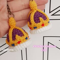 the crocheted earrings have been made to look like princess zelda's crown