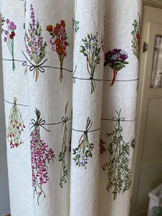 the curtains are decorated with flowers on them