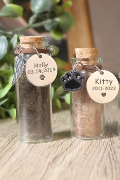 three glass jars with personalized tags on them