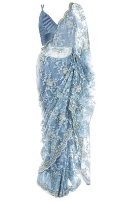 Pale blue silk top, paired with a lacy net saree embellished with beaded blue and silver florals. Blue Floral Saree, Blue Sari, Spaghetti Strap Blouse, Strap Blouse, Stitched Saree, Scallop Border, Spaghetti Strap Blouses, Floral Saree, Western Wear Dresses