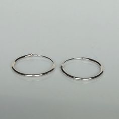 IMPORTANT **Please go through all the pictures i have posted for a listing with a ruler, on a model, on my hand, to get an exact idea of the actual size of the item. ✦Please go through all the pictures on this listing to get a clear idea of the actual size of the piece. Sterling silver ear hoops. Dimensions: 1 x 16mm Price listed is for a PAIR of hoops. These earrings are made of 925 hypoallergenic sterling silver. Most of my pieces come with a 925 stamp. Can be packaged in a gift box. I can inc Silver Dainty Hoop Earrings For Everyday, Dainty Silver Hoop Earrings For Everyday, Simple Nickel-free Hoop Cartilage Earrings, Simple Small Hoop Sterling Silver Earrings, Silver Sterling Hoop Earrings With Simple Design, Sterling Silver Hoop Earrings With Simple Design, Silver Hoop Earrings Simple Design For Gift, Simple Adjustable Sterling Silver Hoop Earrings, Minimalist Nickel-free Silver Hoop Earrings