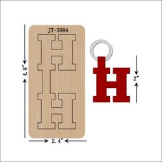 a wooden keychain with the word h on it next to an image of a door