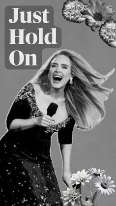 a black and white photo of a woman singing into a microphone with the words just hold on