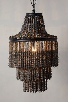 a chandelier with beads hanging from the ceiling