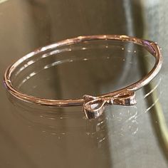 New Rose Gold Bangle Bracelet By Kate Spade. A Bow On The Top And A Box Tab Insert Clasp. Feminine Rose Jewelry For Party, Feminine Rose Gold Metal Jewelry, Feminine Rose-colored Party Jewelry, Elegant Pink Gold Bracelets As Gift, Chic Rose Gold Jewelry With Bracelet Strap, Elegant Pink Gold Bracelet As Gift, Elegant Pink Gold Bracelet For Gift, Elegant Rose Colored Bracelet Jewelry, Elegant Rose Color Bracelet For Gift