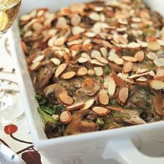 a casserole dish with almonds and broccoli