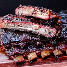 ribs with bbq sauce and onions on a cutting board