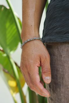 These unique Labradorite cubes are individually threaded to ensure a perfect drape on the wrist. Chosen for their iridescent play of colors and mystical properties, this handcrafted bracelet features sterling silver details and a distinctive silver skull bead. Sterling Silver Labradorite 4mm Thickness Lobster Clasp Handcrafted in LA Labradorite: Protection, Transformation, Balance, Creativity Determining your bracelet size: Encircle your wrist with a flexible tape measure and record the measurem Adjustable Sterling Silver Beaded Fusion Bracelets, Everyday Moonstone Bracelets With Gemstone Beads, Everyday Moonstone Gemstone Beads Bracelets, Moonstone Beaded Bracelets With Natural Stones, Everyday Jewelry With Gemstone Beads And Labradorite, Everyday Jewelry With Labradorite Gemstone Beads, Everyday Sterling Silver Beaded Bracelet With Natural Stones, Everyday Labradorite Jewelry With Gemstone Beads, Everyday Faceted Rondelle Bracelets