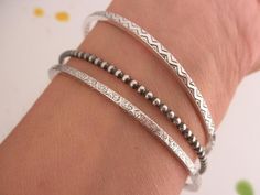 "Please verify the dimensions of the item you are purchasing, as they can appear. larger on screen. Handmade bangle bracelets, made with 925 solid sterling silver. Set of 3 bangles: 1 - 2.2mm beaded 1 - 2 x 2.7 square shape geometrical pattern (design on 2 sides, inside and outside ) 1 - 2.2mm square shape swirl pattern (design on 4 sides) Oxidized to highlight the detail. ------------------ Sizes: Choose the size you need from the drop down menu: XS - 2.25\" INNER diameter = 7 1/2\" circumferen Unique Oxidized Bangle Bracelet, Sterling Silver Bracelet With Oxidized Finish For Everyday, Everyday Sterling Silver Bracelet With Oxidized Finish, Minimalist Oxidized Bangle Bracelets, Minimalist Oxidized Finish Bracelets As Gift, Minimalist Oxidized Finish Bracelets For Gift, Minimalist Bracelets With Oxidized Finish As Gift, Minimalist Oxidized Bangle Bracelet, Silver Bohemian Hand Forged Bracelets