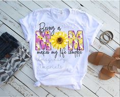 a t - shirt with the words being a mom makes my life simple on it