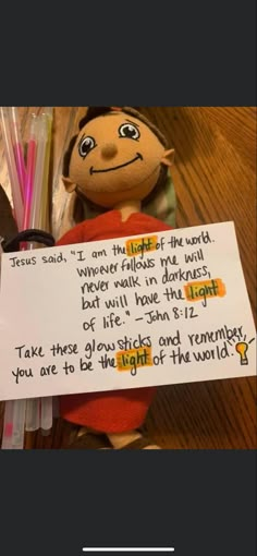 a stuffed animal with a note attached to it