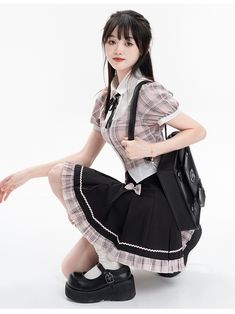 Get the perfect mix of collegiate charm and cute style with our pink plaid puff sleeve blouse and black high waist box pleat skirt set. The pink plaid puff sleeve blouse adds a touch of whimsy with its playful design, while the black high waist box pleat skirt exudes sophistication and elegance. This set is perfect for those who love the "fake two-piece" look, and can be mixed and matched with other items for a variety of stylish outfits.   Please note that this set includes the blouse and skirt Short Puff Sleeve Blouse, Puff Sleeves Blouse, Layered Outfit, Preppy Fashion, Black Suspenders, Gothic Skirts, Box Pleat Skirt, Pleat Skirt, Layering Outfits