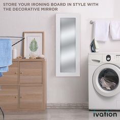 a washer sitting next to a dryer on top of a wooden cabinet in a bathroom