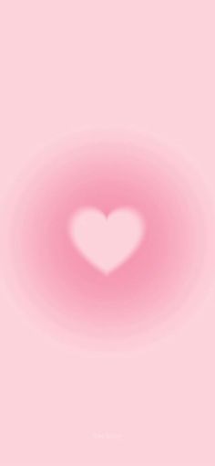 a pink background with a white heart in the center and light at the end that makes it appear to be blurry