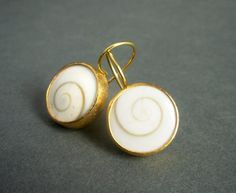 Timeless and stylish, these pretty earrings are beautiful for daytime as well as evening wear. In their simplicity, these earrings make a sculptural, contemporary statement.A pair of slightly domed operculum shells are bezel set in a combination of 22-karat gold and 18-karat gold.The gold has a matte/brushed finish.These hand made earrings measure about 1/2" in diameter and 7/8" from top of the ear wire to the bottom of the earrings.In millimeters, the earrings measure about 13 mm in diameter, a Swirl Yellow Gold Earrings For Gift, Yellow Gold Swirl Earrings For Gift, Handmade Spiral Yellow Gold Earrings, Yellow Gold Spiral Pierced Earrings, Yellow Gold Spiral Earrings With Ear Wire, Vintage Style Wedding Rings, 22k Gold Earrings, Golden Spiral, Earrings Golden