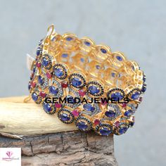 Sapphire Silver Bracelet, Pave Diamond Bracelet, Ruby Gemstone Bracelet, Gemstone 925 Silver Jewelry, Gold Vermeil Bracelet, Wedding Jewelry Gross Weight: 86.29 gram Gemstone Weight: 64.75 cts Diamond Weight: 4.02 cts Bracelet Size: 7.5 inch NOTE:- All The Products Are Designed And Manufactured In My Workshop By Me & My Team. Shown Products Are Purely Handmade. Custom Orders Are Open Handly Accepted. We Are the Perfect Choice For Any Custom Jewelry Manufacturing. For Bulk Orders Please Messa Multi-stone Round Diamond Bracelet For Anniversary, Fine Jewelry Multi-stone Bangle Bracelet, Cubic Zirconia Multi-stone Bangle, Multi-stone Cubic Zirconia Bangle, Multi-stone Diamond Bangle Bracelet Gift, Oval Gemstone Bangle For Wedding, Oval Gemstone Wedding Bangle, Sterling Silver Multi-stone Bracelet, Cubic Zirconia Bangle Bracelet With Stone Setting