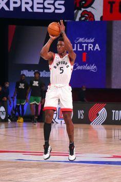 a basketball player is getting ready to dunk the ball