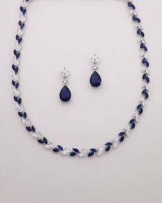 This exquisitely crafted Wedding Jewelry Set boasts top grade cubic zirconia clear and sapphire colored blue stones in marquise and pear cuts. Perfect for the bride who wants a touch of blue or mother of the bride or groom to finish off their wedding day attire.  DETAILS * High quality cubic zirconia.  * Earrings measure 1 1/4 inch long. * Necklace measures 17 1/2 inches long. * Perfect for brides, bridesmaids, mother of the bride, mother of the groom, prom, or any special occasion.  * Optional bracelet is adjustable with a removable extender from 7-8 inches long. * Finish: silver. * Hypoallergenic, lead-free & nickel-free. ADDITIONAL LENGTH WITH EXTENDER * Necklace extender available here: https://www.etsy.com/listing/1527588142/extender-for-necklace-clasp-extender?ref=listings_manager_gr Formal Necklace, Blue Jewelry Set, Blue Sapphire Jewelry, Clear Jewelry, Earrings Necklace Set, Wedding Jewelry Set, Necklace Extender, Blue Stones, Jewelry Card