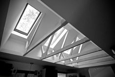 the interior of a modern house with skylights