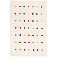 a white rug with multicolored dots on it