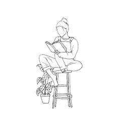 a woman sitting on a stool reading a book with a potted plant behind her