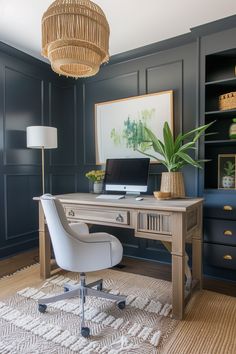 a desk with a chair and a laptop on it in front of a bookcase