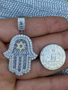 "Iced Out Star of David Hamsa Hand of God Pendant LISTING IS FOR ONE PENDANT, NO CHAIN Hand of G-d Together with the star of David it a very powerful symbol! SUPER ICY! Solid 925 sterling silver...never turns green This is a lifetime piece 1.5\" big - 2\" w bale Weighs 16.4 grams Color doesn't change as its real 925 sterling silver 14k gold option has real yellow gold bonded to natural silver Handmade in Italy Very detailed 3-D micropave design Micropaved handset simulated diamonds (CZ) Nice mix Silver Cubic Zirconia Star Of David Jewelry, God Pendant, Diamond Ice, Hamsa Pendant, Star Of David Pendant, Gold Bond, Family Jewels, Man Made Diamonds, Diamond Star