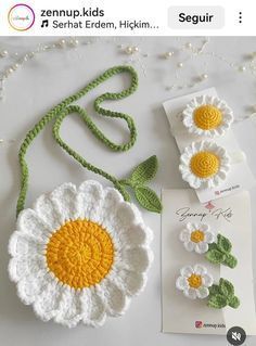 two crocheted flowers are sitting next to each other