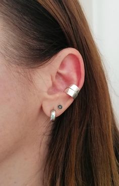 Capture attention with this stunning Wide Double Wrapped Conch Ear Cuff. Made from high-quality Sterling Silver 925, this cuff features a wide band for a bold and stylish look. See my whole jewelry collection here--> https://www.etsy.com/shop/SosyGallery Follow Sosy Gallery on Instagram @sosy_gallery Twitter--> https://twitter.com/sosygallery Facebook--> https://www.facebook.com/sosygallery https://gr.pinterest.com/sosygallery/ Adjustable Classic Silver Ear Cuff, Classic Adjustable Silver Ear Cuff, Classic Adjustable Sterling Silver Ear Cuff, Wrap Earrings, Ear Cuffs, Cuff Earrings, Wide Bands, Conch, Silver 925