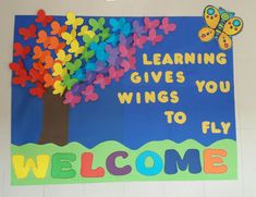 a bulletin board with butterflies on it and the words learning gives you wings to fly