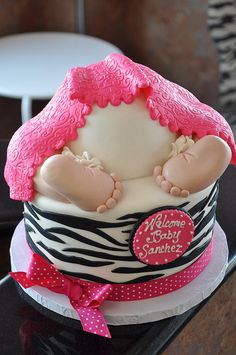 a cake that is shaped like a baby in a hat