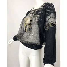 Description: Jean Paul Gaultier vintage sheer black blouse Hand painted rapunzel in gold on front Sheer black and ivory floral print Mesh fabric mixed all throughout Slips over head Made in Italy Bust: 38"-46" Waist: 34"-38" Circa 1990's Details: Size: L Color: Black/MultiMaterial: Sheer Chiffon/Mesh Condition: Excellent Brand: Jean Paul Gaultier Shipping: STANDARD: $9.95 EXPEDITED: $19.95 Jean Paul Gaultier Vintage, 1970s Blouse, 90s Jean, Backless Halter Top, Hooded Tunic, Black Sheer Blouse, Black Neck, Paisley Top, Turtleneck Shirt