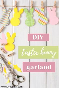 some paper bunnies are hanging on clothes pins with bunny ears and easter bunnies