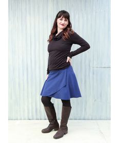 "This skirt will fit seamlessly into your wardrobe. It easily layers with leggings and boots, or works well on it's own with only sandals. Not too short and not too long, and hits just above the knee. The wide waistband can be worn higher or lower, or folded over to adjust the length. * Faux wrap skirt * 5\" band lays flat or folds over *  Total length: ~23\" (can be customized) SIZE Custom made to order in any size. See images for size chart & measurement guide. COLOR This skirt is available an Plus Size Above Knee Boots, Cowl Neck Blouse, Faux Wrap Skirt, Jeans And Flats, Navy Fabric, Cowl Neck Top, Traverse City, Good Stretches, Basic Tops