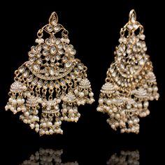 A beautiful blend of intricacy and elegance! Handcrafted with precision, this pair features beautiful stone work. Approximate earrings length is 4". The earrings are available in 2 options: Earrings with Saharay Earrings without Saharay Please select the desired option at the time of purchase. Gold-plated on high-quality brass as base metal. Made by order. Kindly allow 4-6 weeks for the delivery of this item. For custom or urgent requests, please contact support@alacouture.com. *Please Note: We Faux Stone, Stone Work, Base Metal, Free Gifts, Diamond Earrings, Gold Plate, Crown Jewelry, Plating, Brass