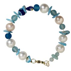 This stunning Gold Plated Freshwater Pearl & Seaglass Bracelet is the perfect blend of coastal charm and bohemian elegance. Featuring blue round sea glass beads paired with lustrous freshwater pearls, this bracelet is adorned with 18K gold-plated stainless steel lobster claw clasps and strong 14K gold-plated jump rings for durability and style. The real 14K gold-plated copper wire and beading add a luxurious touch, making this bracelet a must-have for any beach-loving, free-spirited soul. Ideal for festivals, summer events, and as a thoughtful gift for birthdays, Christmas, or Chanukah. Boho jewelry Festival bracelet Coastal vibes Beach chic Freshwater pearls Sea glass jewelry 18K gold plated Summer accessory Hippie aesthetic Spring fashion Christmas gift Chanukah present Stocking stuffer Seaglass Bracelets, Festival Armband, Seaglass Christmas, Festival Bracelets, Sea Glass Beads, Hippie Aesthetic, Sea Glass Bracelet, Trendy Bracelets, Coastal Vibes