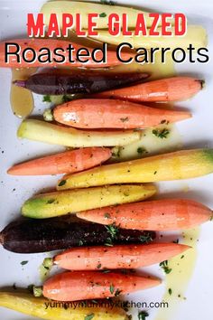 roasted carrots and other vegetables are on a white plate with the title maple glazed roasted carrots