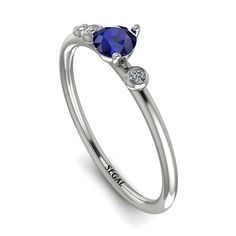 Pretty minimalist thin ring in perfect proportions and style can be used as a gift for your loved one. Minimalist style with immensely beautiful Sapphire enhances the beauty of this ring. This ring would express love to your loved one. Stock Number: 1832 Metal Setting Metal Type: 14K White Gold Main Stone Type: 100% Natural Blue Sapphire Size: 0.25Ct / 4mm Shape: Round Cut Color: Blue Clarity: SI (Eye Clean) Additional Stones Stone Type: Natural Conflict-free Diamonds Number / Total Weight: 2 St Vintage Engagement Rings Sapphire, Ruby Bands, Express Love, Black Diamond Engagement, Flower Engagement Ring, Vintage Sapphire, Black Diamond Ring Engagement, White Diamond Ring, Rings Cool