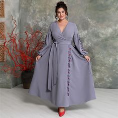 mmerse yourself in a world of luxury with our evening dress that captivates at first glance. This stunning wrap-style dress promises to highlight your femininity and elegance.   Embroidery made from gray and red silk threads skillfully adorns the sleeves and skirt, adding a unique charm and style to the look. The wide belt not only accentuates the waist but also adds refinement to the silhouette.   charm and sophistication. The sleeves are voluminous, with elastic at the cuffs The long and voluminous skirt, which flows beautifully with every movement, impresses with its grace and sophistication. This dress is the perfect choice for special occasions where you want to be the center of attention. Fabric: Barbie modal (high-quality suiting fabric of Korean origin with added elastane). Due to Voluminous Skirt, Skirt Elegant, Dress With Embroidery, Evening Dress Fashion, Wide Belt, Red Silk, Dress Clothes For Women, In A World, Style Dress