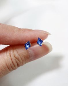 Tiny diamond shaped stud earrings in a luxe sapphire blue - an everyday staple for the modern minimalist.  Hand set faceted vintage Czech crystals.  Hardware has been tumble polished for hours to achieve a satin finish, butterfly backings.  Packaged in a beautiful gift box.Perfect for standard lobe piercings and small enough to be great stacking pieces for 2nd and 3rd piercings.MATERIALS[ stone ] vintage Czech crystal[ silver ] rhodium silver filled, sterling silver posts[ gold ] 14k gold filled 3rd Piercings, Sapphire Earring, Lobe Piercings, Blue Sapphire Studs, Formal Earrings, Sapphire Earrings Studs, Sapphire Studs, Citrine Earrings, Tiny Earrings